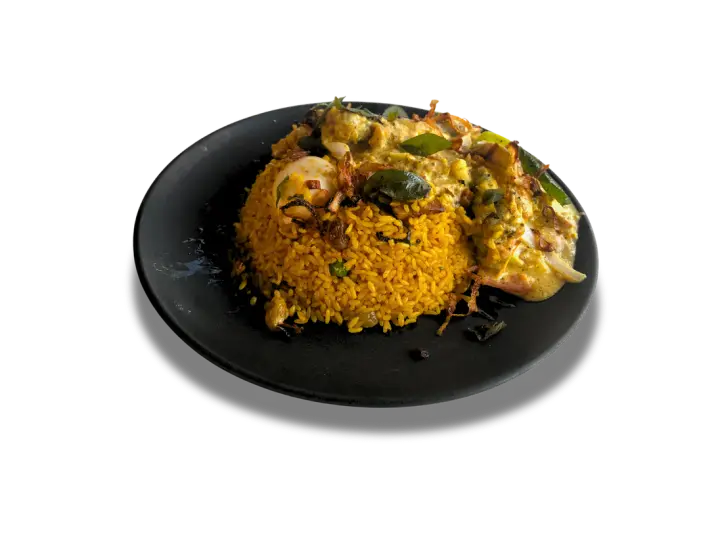 Mr. Fawz rice and curry served on a black plate